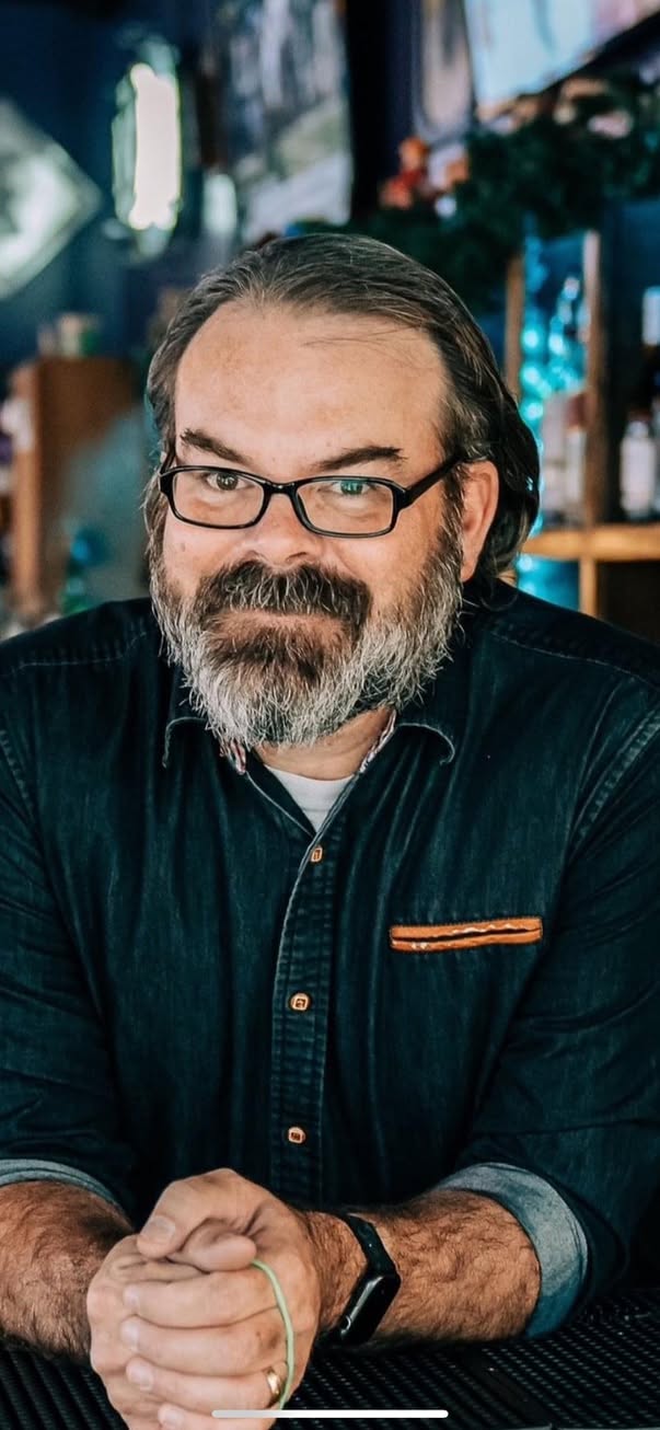 Ben Mouton, restaurant operations leader, at the bar of his restaurant